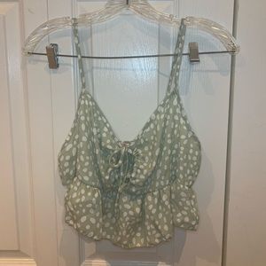 green cropped tank with a floral design